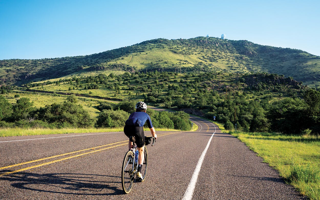Cyclist racing through a curve